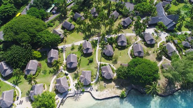 
Aerial view of tropical paradise of Moorea, turquoise crystal clear water of scenic blue lagoon, typical over water bungalows - South Pacific Ocean, French Polynesia landscape from above, 4k