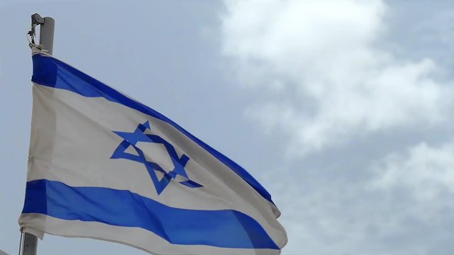 Flag of Israel slowly fluttering in a strong wind