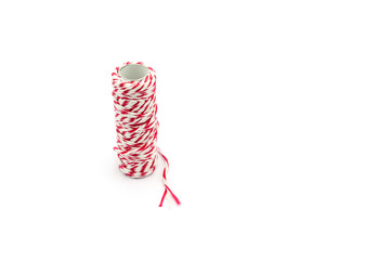 red and white yarn roll isolated on white background