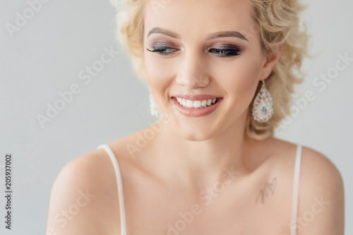 Beautiful Curly Hair Smiling Girl With Healthy Wavy Long Blonde