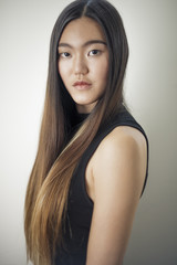 Naklejka premium Young Asian Model posing for fashion and portfolio portraits