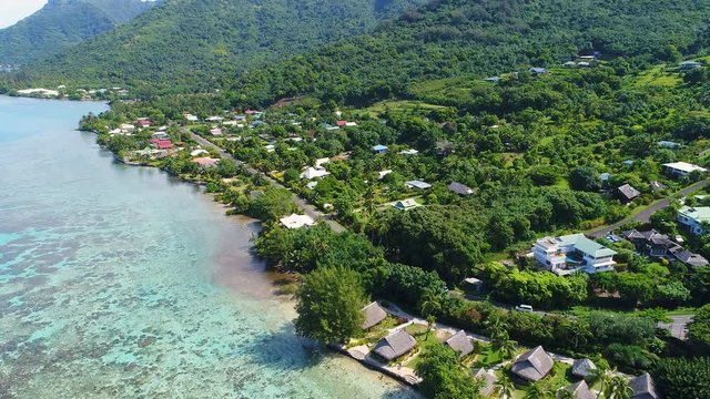 Aerial view of tropical paradise of Moorea island, lush green vegetation - South Pacific Ocean, French Polynesia landscape from above, 4k UHD