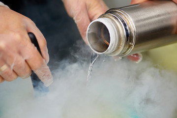 Chef is cooking ice cream with liquid nitrogen