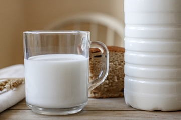a glass of fresh milk on the wooden table