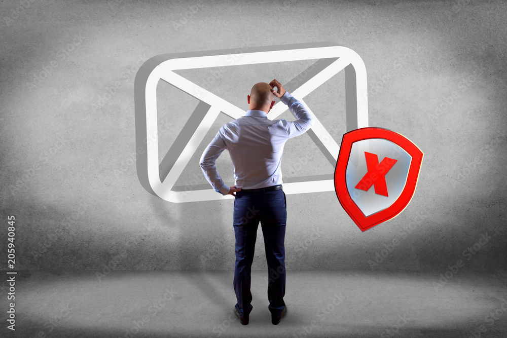 Poster businessman in front of a wall with spam message email symbol displayed on a futuristic interface - 