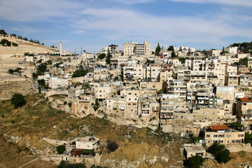 Fototapeta na wymiar View of houses behind the Wailing Wall and the City of David of Jerusalem.