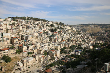 Fototapeta na wymiar View of houses behind the Wailing Wall and the City of David of Jerusalem.