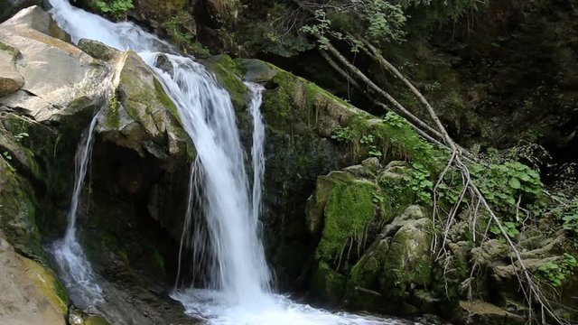 view of Kamianetskyi waterfall is located on the Kamianka river, national park Skolevski beskidy, Lviv region of Western Ukraine