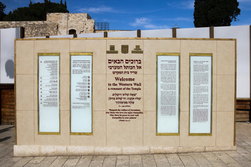Welcome sign at the Wailing Wall in Jerusalem with historical references.