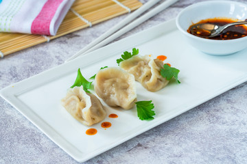 Chinese pork dumplings - dim sum - with sweet chili dipping sauce
