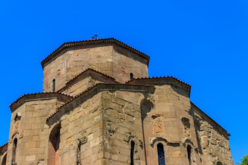 Fototapeta na wymiar View on the Jvari monastery, orthodox monastery of the 6th century on the rocky mountaintop over the old town of Mtskheta (UNESCO World Heritage site), Georgia