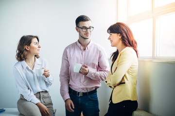 Colleagues chatting at office