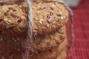 closeup oat large biscuits with sesame, flax and sunflower seeds. Macro