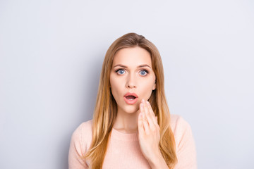 It's impossible! I don't believe you! People facial expressions grimacing big eyes concept. Close up portrait of attractive cute teenage  girl holding palm near mouth isolated on gray background
