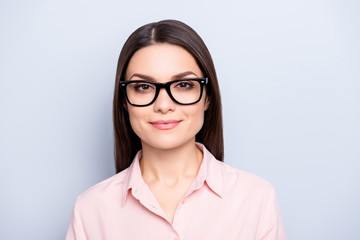 Portrait of clever charming brunette cute pretty woman in glasses, wearing classic shirt, looking at camera, isolated on grey background