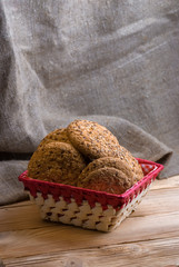 homemade oat cookies with sunflower seeds in basket on wooden table