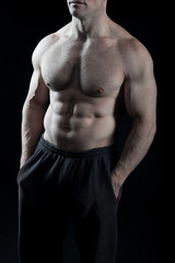 Fototapeta na wymiar Torso with six pack and ab muscles. Torso with fit belly and athletic chest