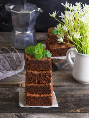 a pile of square pieces of baked brownie