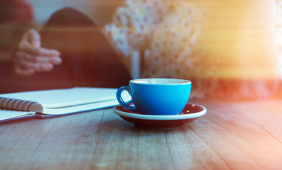Young woman with cup of coffee at home. Visual effects. Blurred background.Cropped