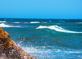 Amazing sea with blue summer wave and rocks, relaxing view of rocks and water