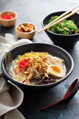 Spicy ramen bowl with noodles and chicken