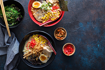 Spicy ramen bowls with noodles, pork and chicken