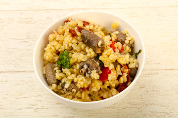 Bulgur with chicken hearts