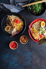 Spicy ramen bowls with noodles, pork and chicken