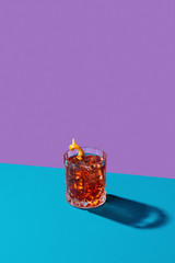 Negroni IBA cocktail, with gin, bitter, vermouth, in pop contemporary style, colorful, dark...