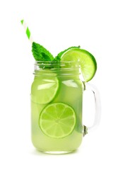 Limeade and mint in a mason jar glass with straw isolated on a white background