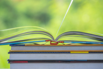Books stack on the wooden chair for business, education back to school concept.