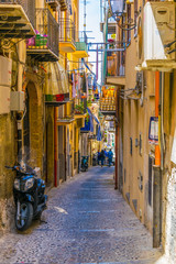 View of a narrow street in Cefalu, Sicily, Italy