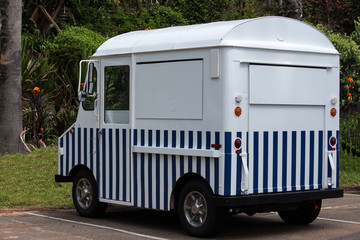Blue white striped food van truck parked after close of business