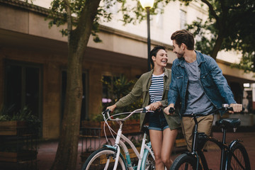Couple with bicycles on the street