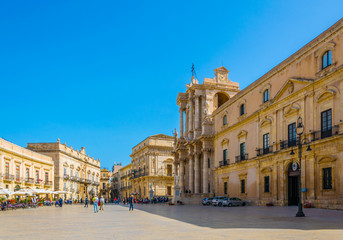 People are strolling on piazza Duomo in Syracuse, Sicily, Italy
