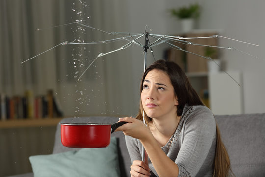 Woman suffering water leaks with a bad insurance concept