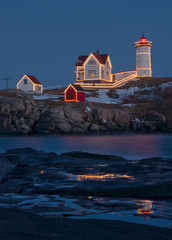 Nubble Lighthouse (also known as Cape Neddick Lighthouse) located in York, Maine with Christmas...