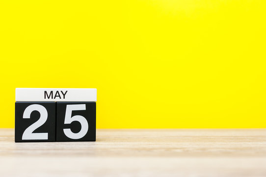 May 25th. Day 25 of may month, calendar on yellow background. Spring time, empty space for text
