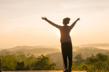 women Travel nature in the mountains,Woman watching the sunrise.