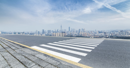 Fototapeta premium Panoramic skyline and modern business office buildings with empty road,empty concrete square floor