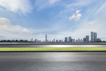 Panoramic skyline and modern business office buildings with empty road,empty concrete square floor
