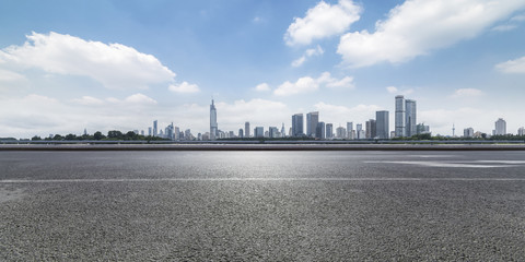 Panoramic skyline and modern business office buildings with empty road,empty concrete square floor