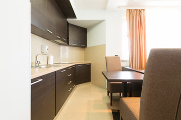 Kitchen in open plan hotel apartment interior