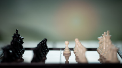 Chess on a Board of wood.  nature background.  game, strategy, management or leadership concept and teamwork. Select focus.