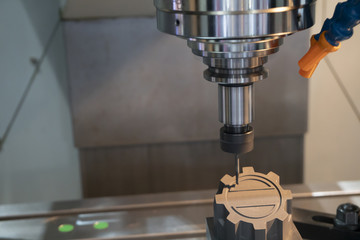 The CNC milling machine cutting the graphite electrode part with the solid ball endmill. Modern...