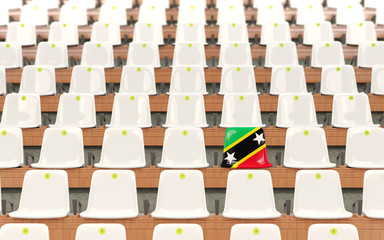 Obraz premium Stadium seat with flag of saint kitts and nevis