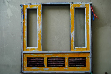 Vintage yellow window frame without glass
