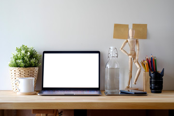 Loft workspace mock up laptop computer on wood table. copy space and blank screen for graphics montage.