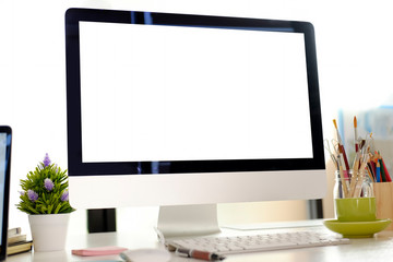 Mock up workspace with blank screen desktop computer in studio creative workplace.