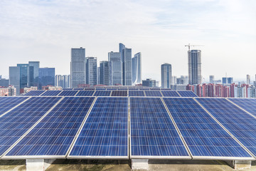 Solar and modern city skyline